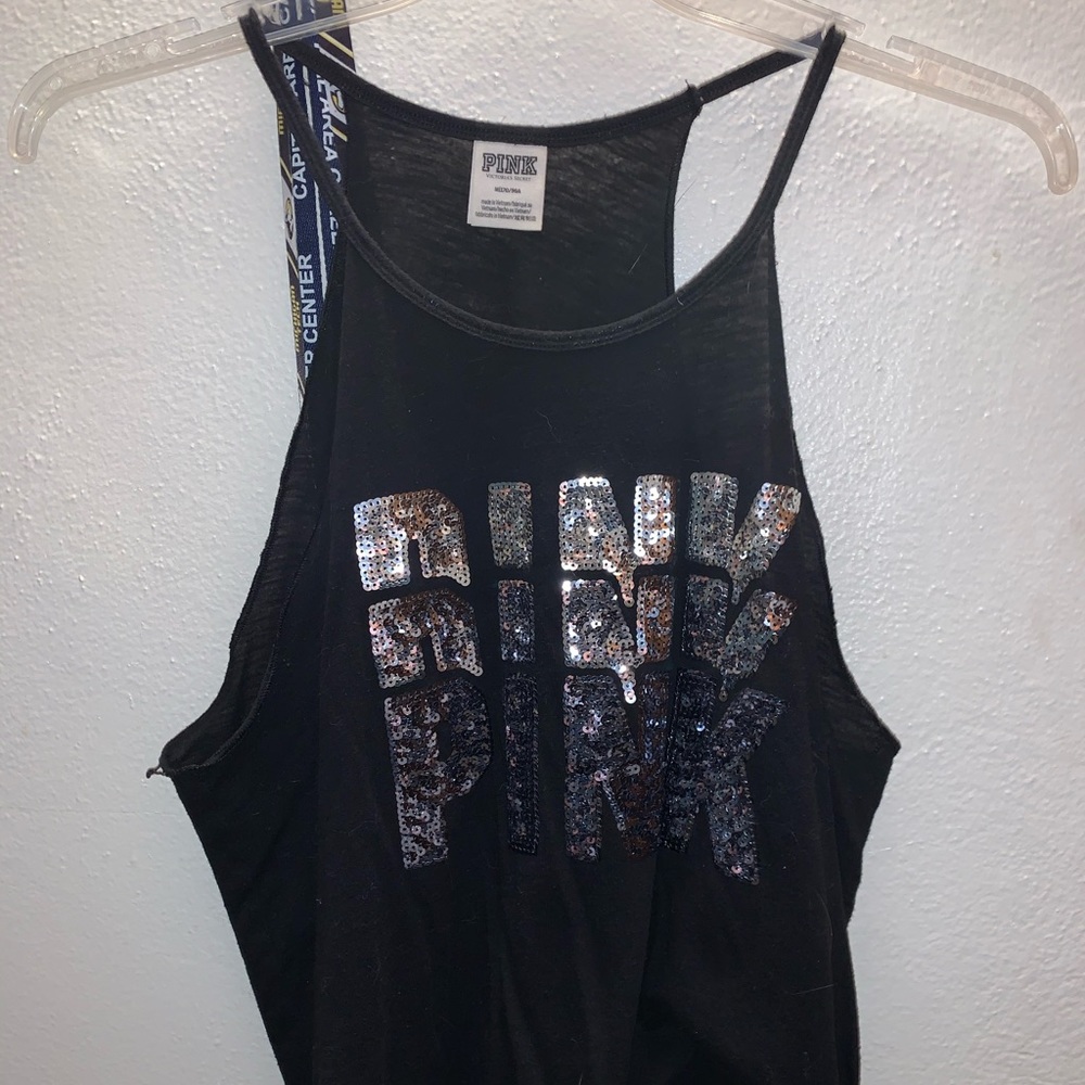 Woman’s black workout tank top.